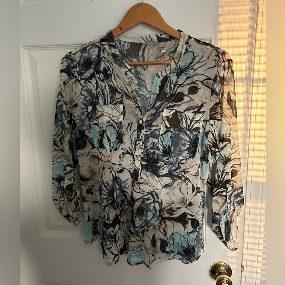 Chico's size 1.  Very cute semi see thru blouse